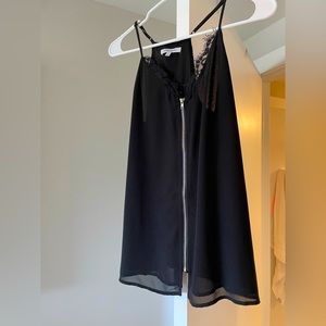 Selling this super cute black top. Barely worn. Looks like new.